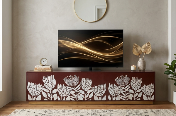 Handcrafted brown Mother of Pearl Inlay 5 door TV unit with white botanical floral design and brass stand in a modern luxury living room